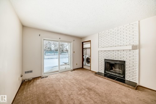 104 70 Alpine Place, St. Albert, AB - Indoor Photo Showing Living Room With Fireplace
