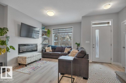 306 Balsam Link, Leduc, AB - Indoor Photo Showing Living Room With Fireplace