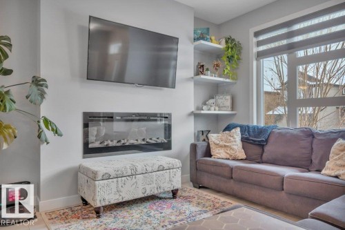 306 Balsam Link, Leduc, AB - Indoor Photo Showing Living Room With Fireplace