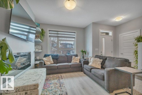 306 Balsam Link, Leduc, AB - Indoor Photo Showing Living Room With Fireplace