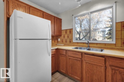 5512 38B Avenue, Edmonton, AB - Indoor Photo Showing Kitchen With Double Sink