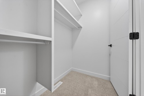 Walk in closet featuring light carpet - 129 Pierwyck Loop, Spruce Grove, AB - Indoor With Storage