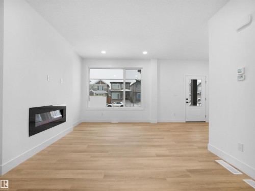 788 Cy Becker Drive, Edmonton, AB - Indoor Photo Showing Living Room With Fireplace