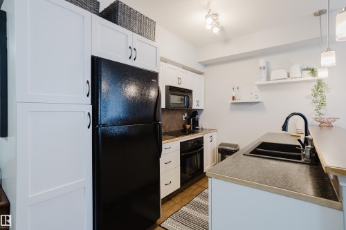 140 4827 104A Street, Edmonton, AB - Indoor Photo Showing Kitchen With Double Sink