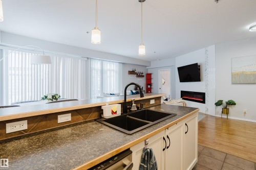 140 4827 104A Street, Edmonton, AB - Indoor Photo Showing Kitchen With Double Sink
