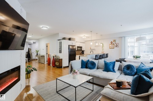 140 4827 104A Street, Edmonton, AB - Indoor Photo Showing Living Room With Fireplace