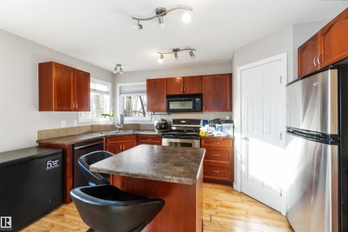 5807 Sutter Pl, Edmonton, AB - Indoor Photo Showing Kitchen With Double Sink