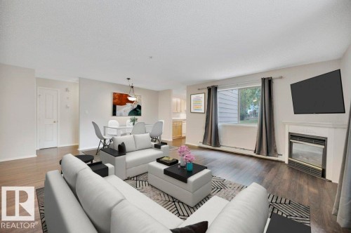 102 2903 Rabbit Hill Road, Edmonton, AB - Indoor Photo Showing Living Room With Fireplace