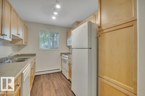 102 2903 Rabbit Hill Road, Edmonton, AB - Indoor Photo Showing Kitchen With Double Sink