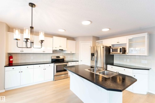 11211 11 Ave Sw, Edmonton, AB - Indoor Photo Showing Kitchen With Double Sink