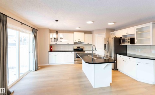 11211 11 Ave Sw, Edmonton, AB - Indoor Photo Showing Kitchen With Double Sink