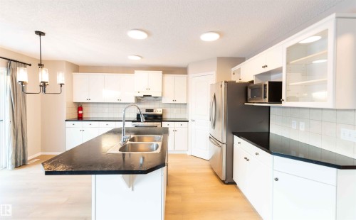 11211 11 Ave Sw, Edmonton, AB - Indoor Photo Showing Kitchen With Double Sink