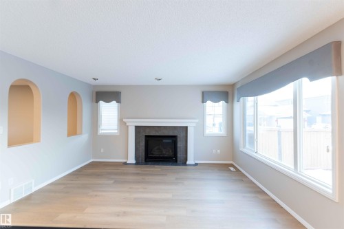 11211 11 Ave Sw, Edmonton, AB - Indoor Photo Showing Living Room With Fireplace