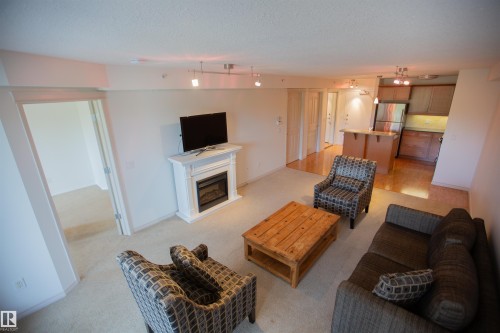 325 7510 89 Street, Edmonton, AB - Indoor Photo Showing Living Room With Fireplace