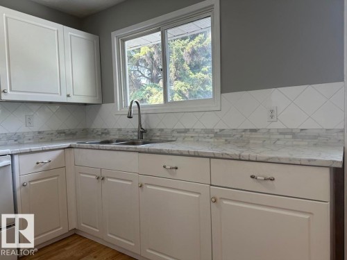 9512/9514 128 Avenue, Edmonton, AB - Indoor Photo Showing Kitchen With Double Sink