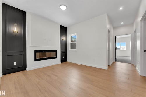31 Eldridge Point(E), St. Albert, AB - Indoor Photo Showing Living Room With Fireplace