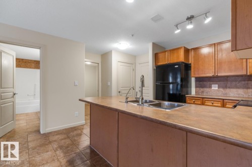 228 400 Palisades Way, Sherwood Park, AB - Indoor Photo Showing Kitchen With Double Sink