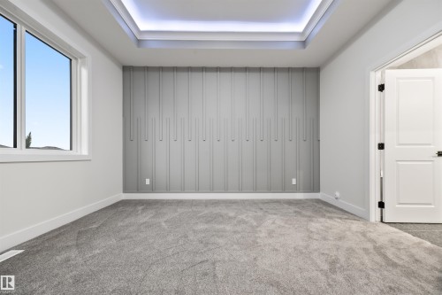 Carpeted spare room featuring baseboards - 3164 Magpie Way, Edmonton, AB - Indoor Photo Showing Other Room