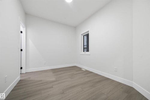 Unfurnished room featuring light wood-style flooring - 3164 Magpie Way, Edmonton, AB - Indoor Photo Showing Other Room