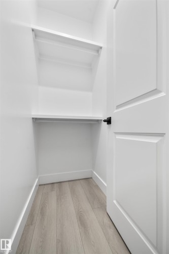 Spacious closet featuring light wood-style floors - 3164 Magpie Way, Edmonton, AB - Indoor With Storage