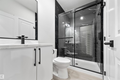 Full bath with vanity and a marble finish shower - 3164 Magpie Way, Edmonton, AB - Indoor Photo Showing Bathroom