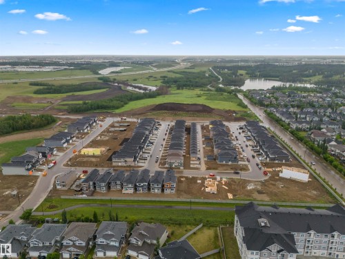 Aerial view of property and surrounding area featuring a nearby body of water and nearby suburban area - 3164 Magpie Way, Edmonton, AB - Outdoor With View