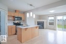 2119 28 Street, Edmonton, AB  - Indoor Photo Showing Kitchen With Fireplace With Double Sink 