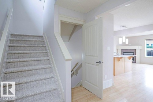 2119 28 Street, Edmonton, AB - Indoor Photo Showing Other Room With Fireplace