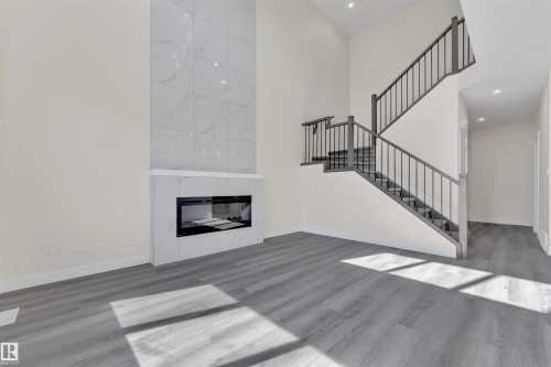 21 Westwyck Link, Spruce Grove, AB - Indoor Photo Showing Living Room With Fireplace