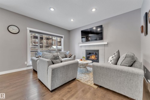 723 57 Street, Edmonton, AB - Indoor Photo Showing Living Room With Fireplace