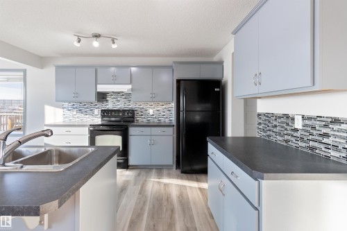 75 Dunlop Wynd, Leduc, AB - Indoor Photo Showing Kitchen With Double Sink