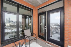 Property entrance featuring brick siding - 