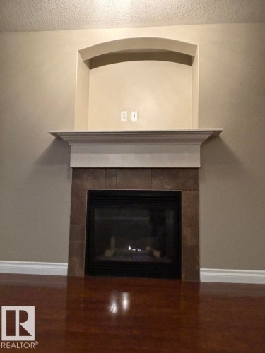 68 Meridian Loop, Stony Plain, AB - Indoor Photo Showing Living Room With Fireplace