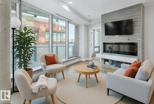 502 11969 Jasper Avenue, Edmonton, AB - Indoor Photo Showing Living Room With Fireplace