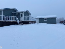 View of front of house with a deck - 