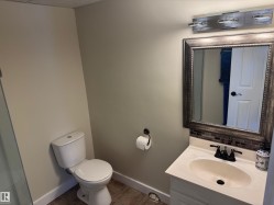 Bathroom with vanity and light tile patterned flooring - 
