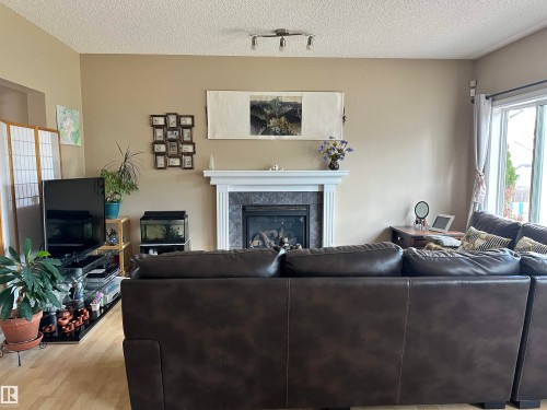 4619 151 Avenue, Edmonton, AB - Indoor Photo Showing Living Room With Fireplace