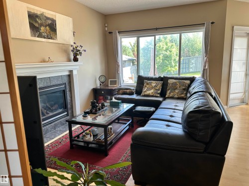 4619 151 Avenue, Edmonton, AB - Indoor Photo Showing Living Room With Fireplace
