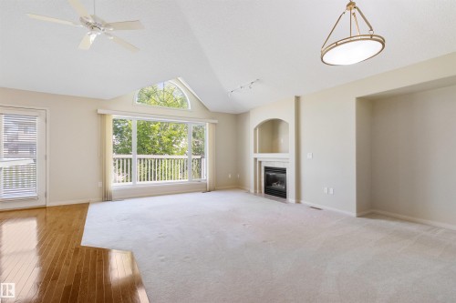 7 10848 8 Avenue, Edmonton, AB - Indoor Photo Showing Living Room With Fireplace