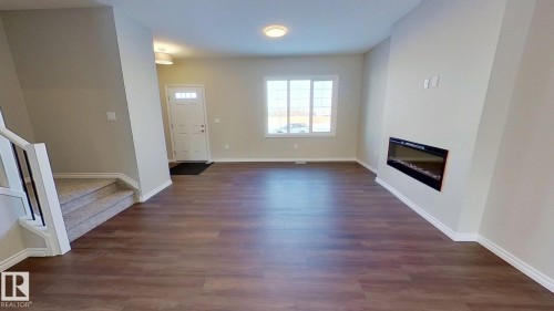 1023 Aster Boulevard, Edmonton, AB - Indoor Photo Showing Other Room With Fireplace