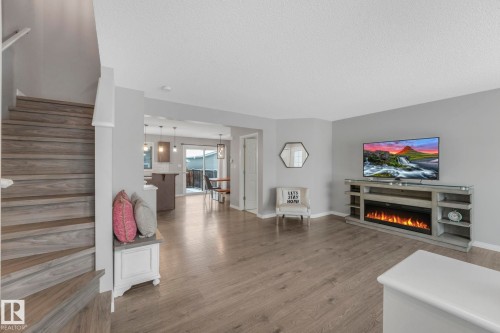 6862 21A Avenue Sw, Edmonton, AB - Indoor Photo Showing Living Room With Fireplace