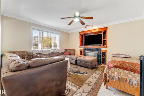 3015 24 Avenue, Edmonton, AB - Indoor Photo Showing Living Room With Fireplace