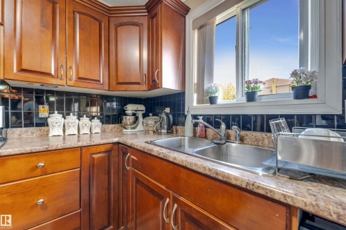 3015 24 Avenue, Edmonton, AB - Indoor Photo Showing Kitchen With Double Sink