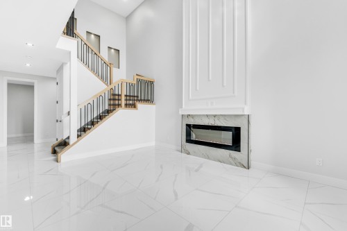 4306 36 Street, Beaumont, AB - Indoor Photo Showing Other Room With Fireplace