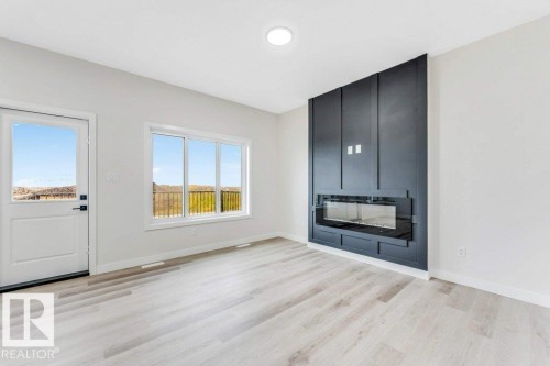 143 Pierwyck Loop, Spruce Grove, AB - Indoor Photo Showing Living Room With Fireplace