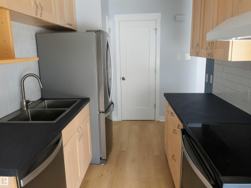J 16405 89 Avenue, Edmonton, AB - Indoor Photo Showing Kitchen With Stainless Steel Kitchen With Double Sink
