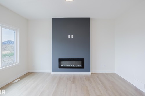 143 Catria Point(E), Sherwood Park, AB - Indoor Photo Showing Living Room With Fireplace