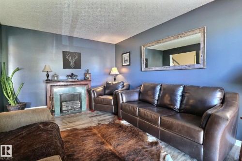 5315 39 Avenue, Edmonton, AB - Indoor Photo Showing Living Room With Fireplace