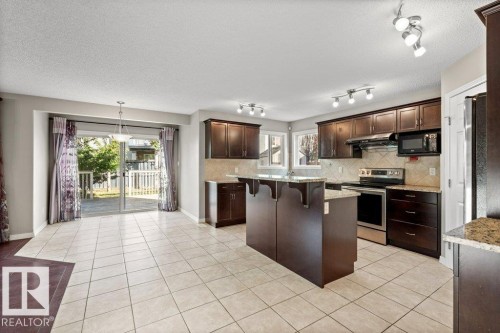 7011 Strom Lane, Edmonton, AB - Indoor Photo Showing Kitchen With Stainless Steel Kitchen With Upgraded Kitchen