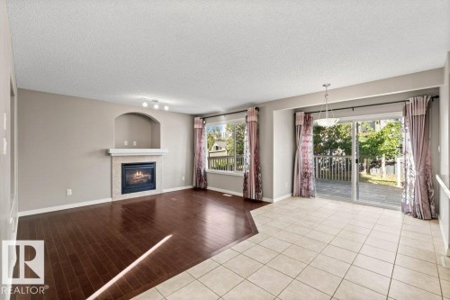 7011 Strom Lane, Edmonton, AB - Indoor Photo Showing Living Room With Fireplace